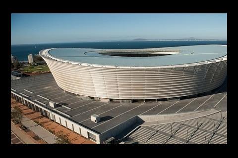 The roof of the Green Point stadium is covered with glass panels while the external cladding allows light to spill out at night